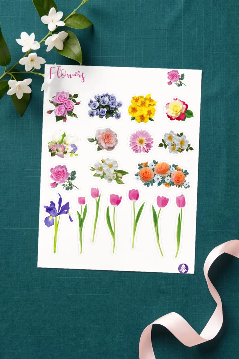 Printed sheet of realistic flower stickers with roses, pansies, a dahlia and pink tulips, on deep teal linen with a branch of white jasmine and a pink silk ribbon